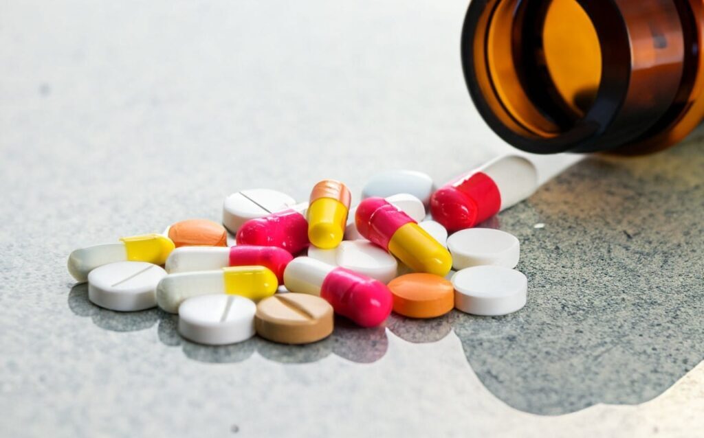 Steroid tablets spilling from a bottle